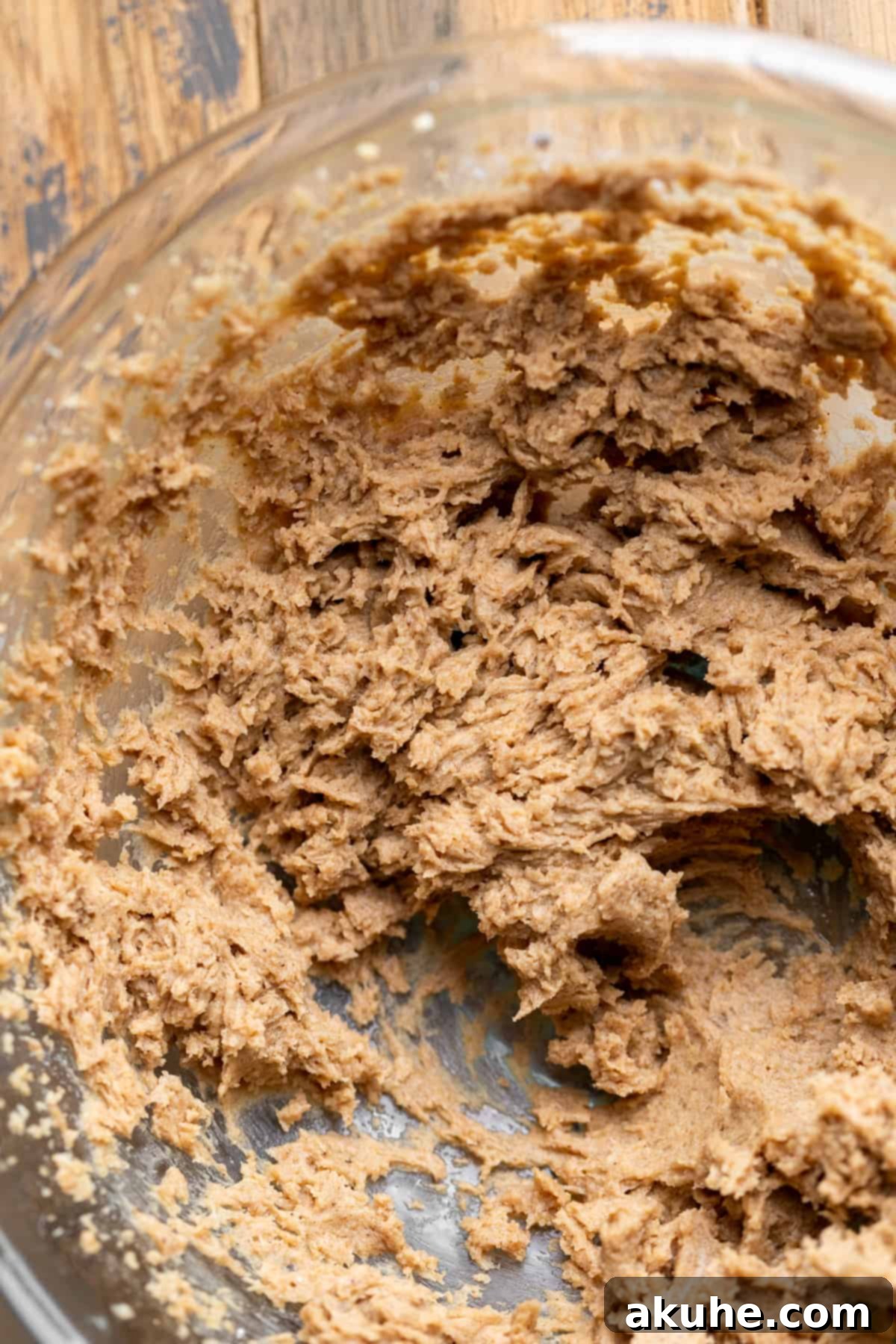 Irresistible Caramel Buns 4 Maple sticky topping in a glass bowl.