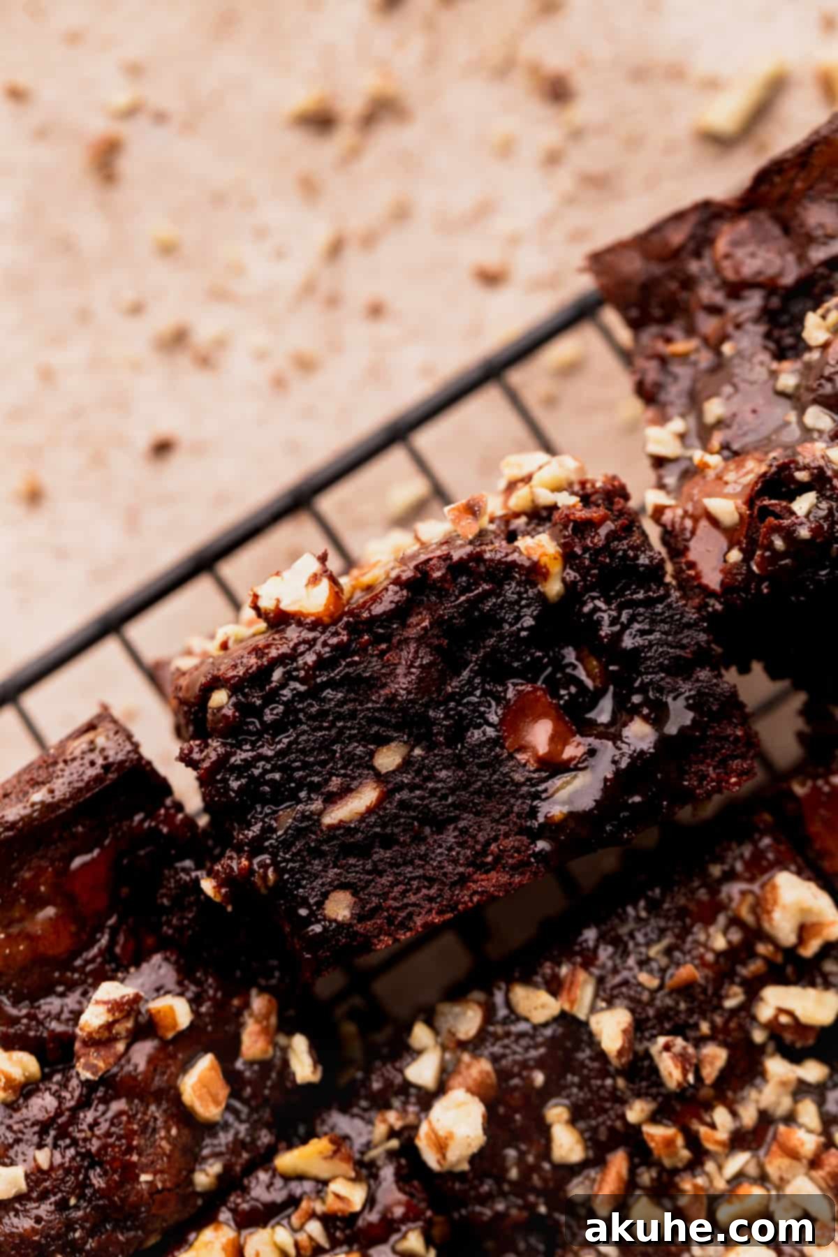 Pecan Caramel Fudge Brownies 2 A single turtle brownie, showing its rich fudgy texture and pecan topping.