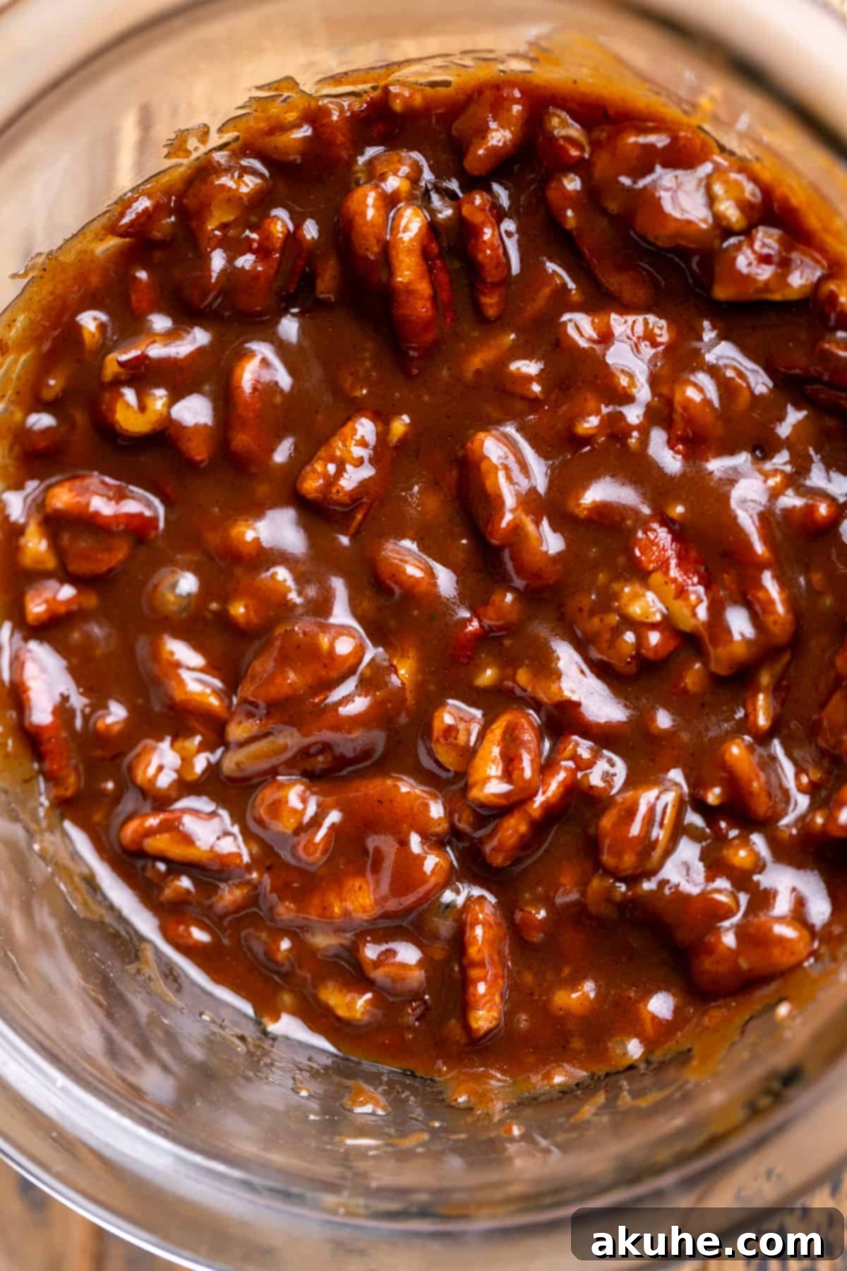 Pecan pie filling cooling in a bowl, ready to be spread.