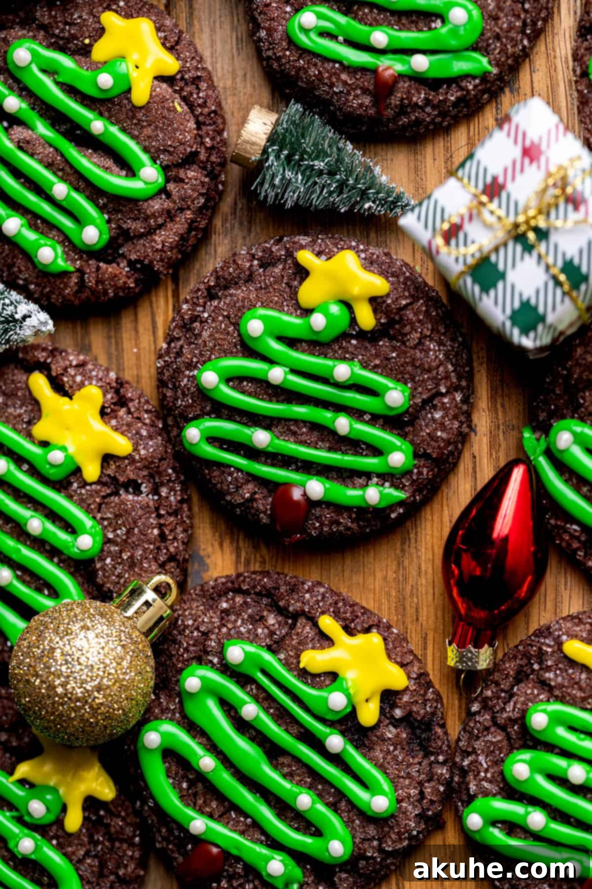 Whimsical Christmas Tree Cookies 2 Christmas tree cookies with Christmas decoratations around it.