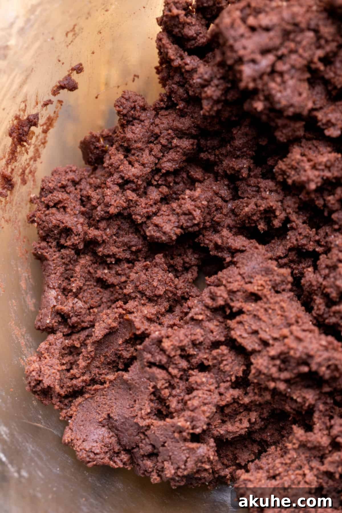 Whimsical Christmas Tree Cookies 5 Chocolate cookie dough in a glass bowl.