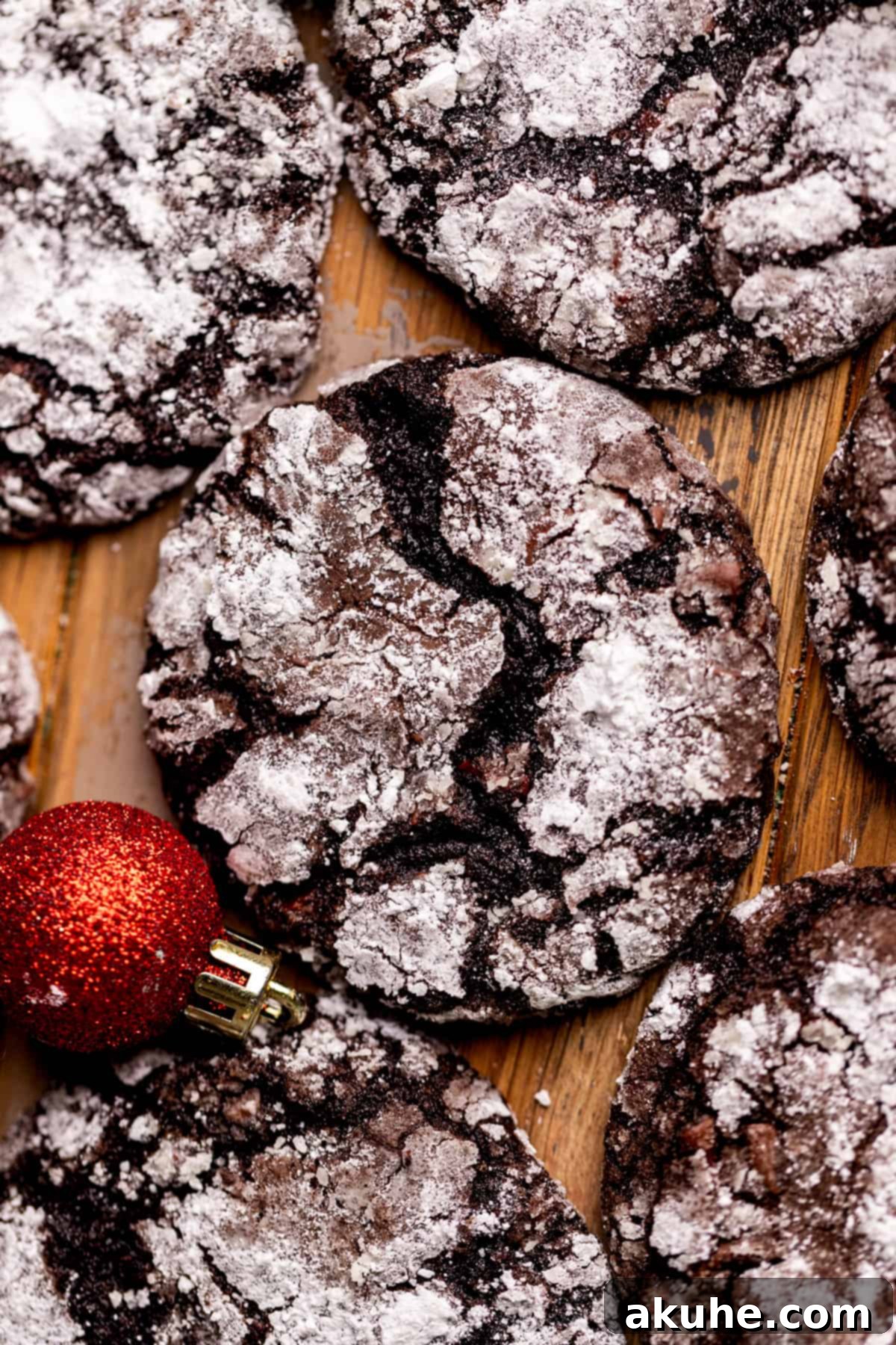 Overhead view of a perfectly baked chocolate crinkle cookie, showing its powdered sugar coating and crinkles.