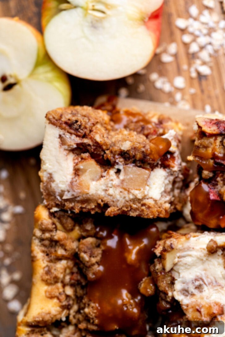 Spiced Caramel Apple Cheesecake Bars 12 A single caramel apple cheesecake bar, beautifully sliced and ready to eat.