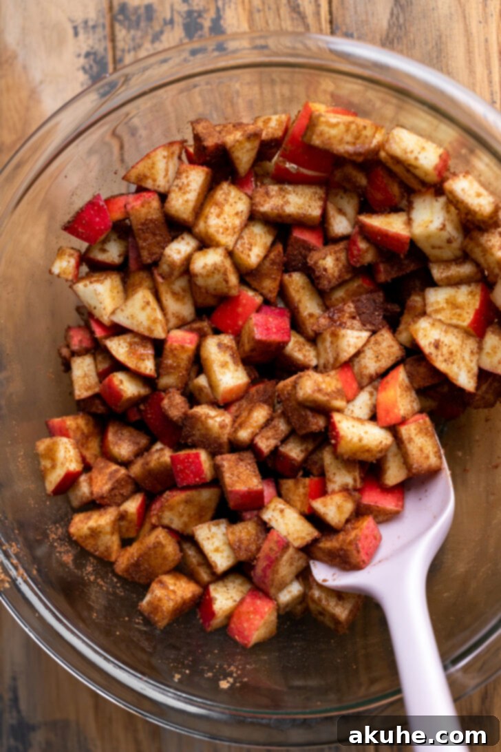 Spiced Caramel Apple Cheesecake Bars 5 Cubed apples in a bowl, ready to be spiced and added to the cheesecake bars.