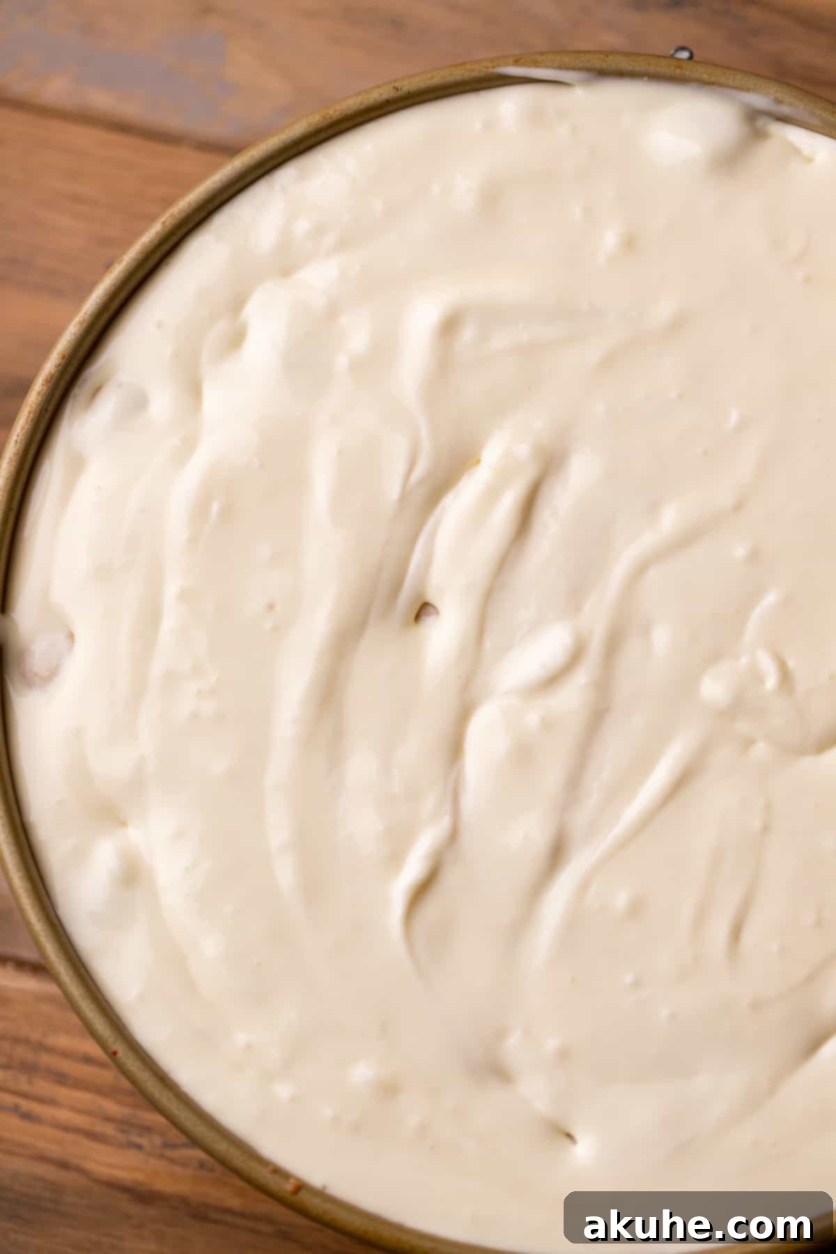 Sugar Cookie Dream Cheesecake 9 Cheesecake batter, studded with edible cookie dough balls, poured over the sugar cookie crust in a springform pan.