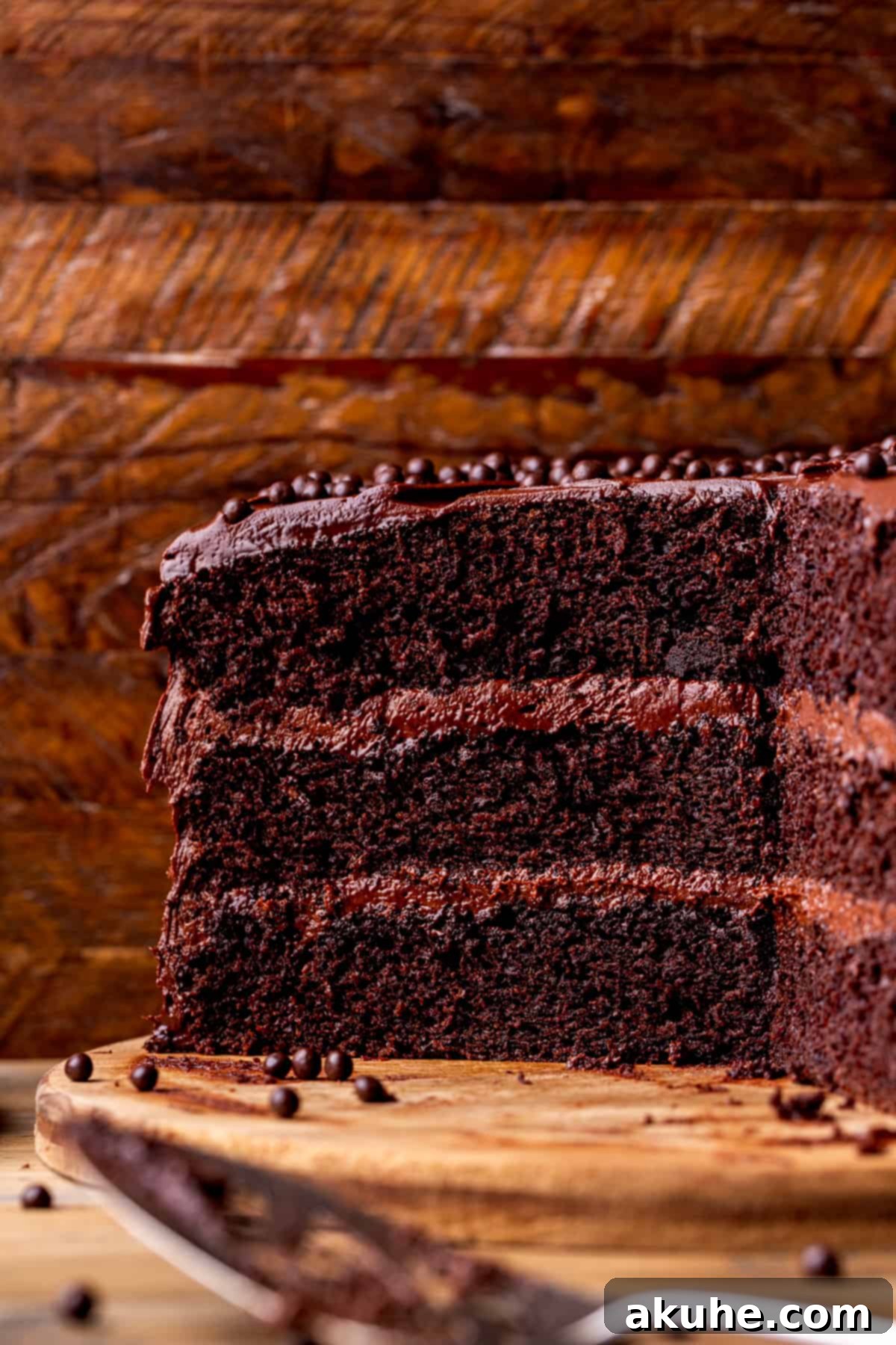 Close up of the inside of the moist chocolate cake, showcasing its rich layers and creamy frosting.