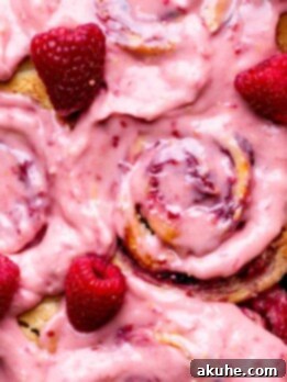 Tangy Lemon Raspberry Buns 10 Lemon raspberry rolls with raspberry frosting on top.