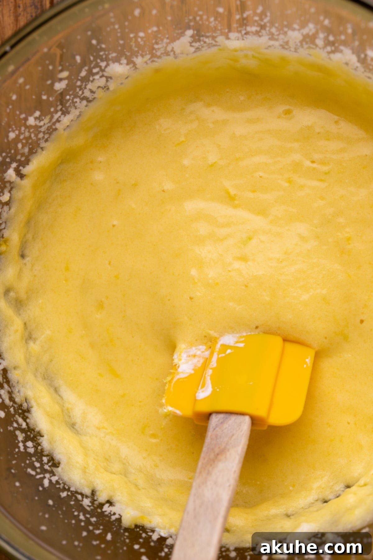 Wet ingredients beautifully blended in a mixing bowl, showcasing the creamy texture.