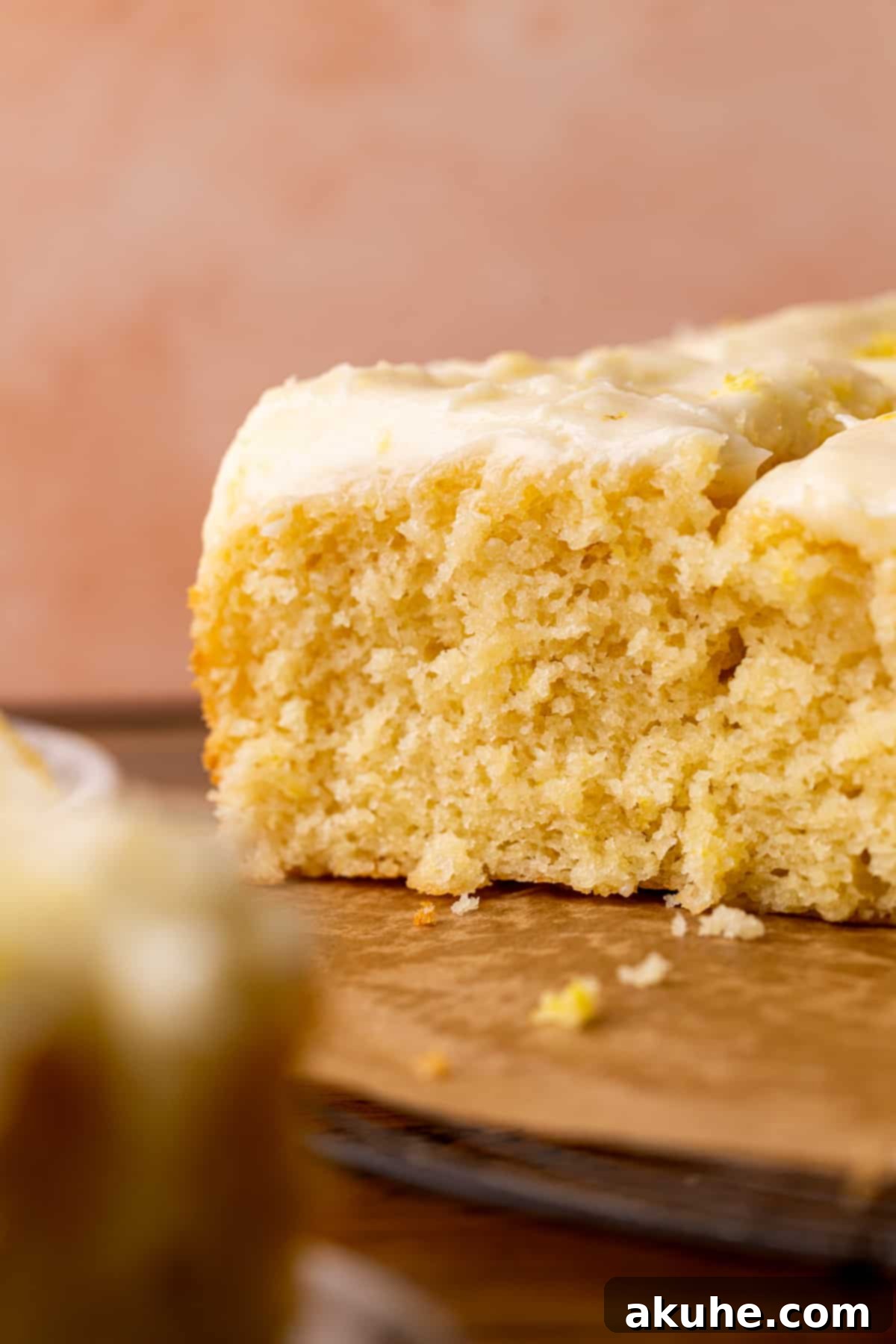 A delectable side view of the lemon drizzle cake, highlighting its layers and perfectly applied frosting.