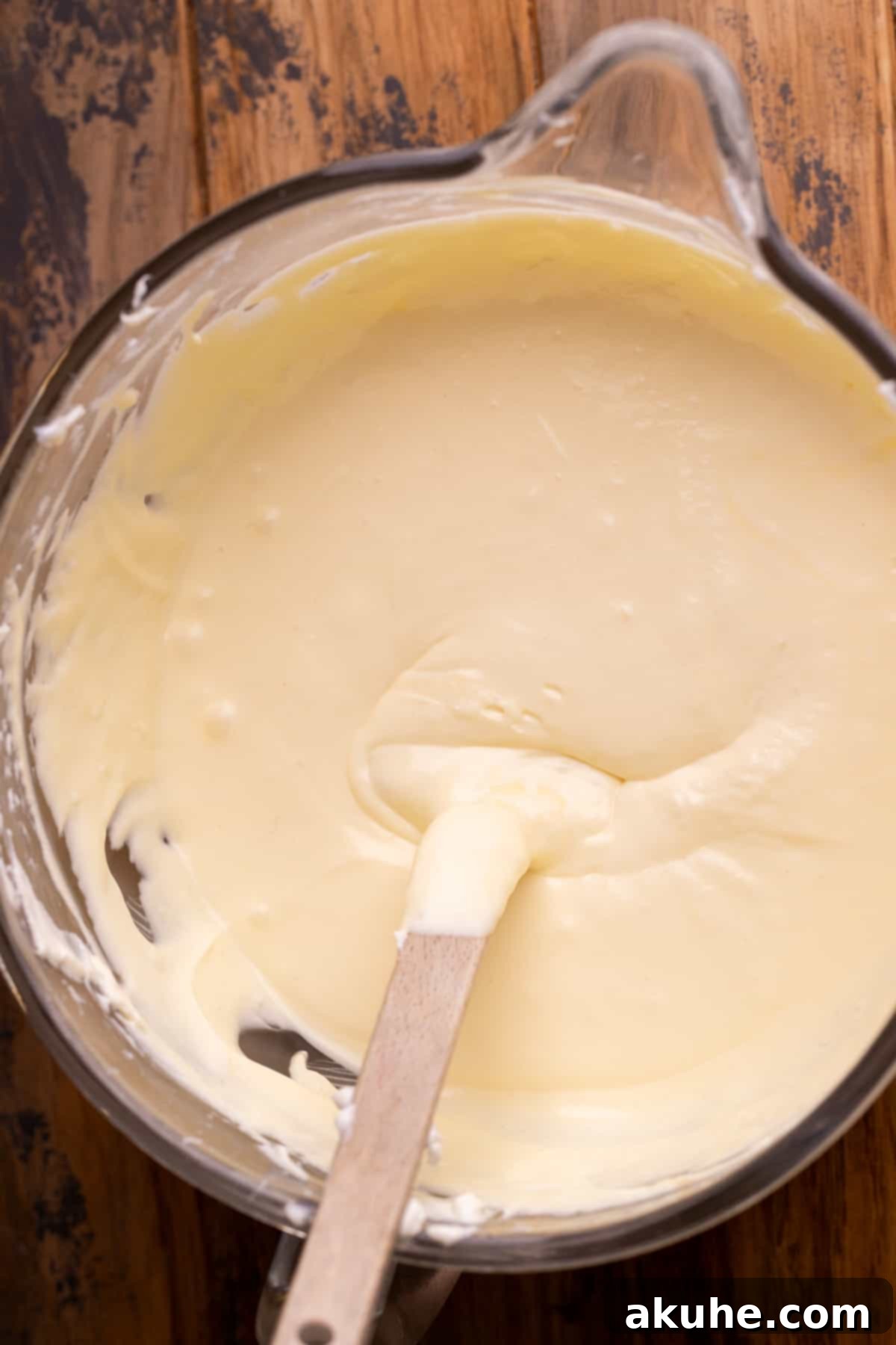 Carrot Cake Swirl Cheesecake 4 A pristine glass bowl filled with the smooth, ready-to-use cheesecake batter.