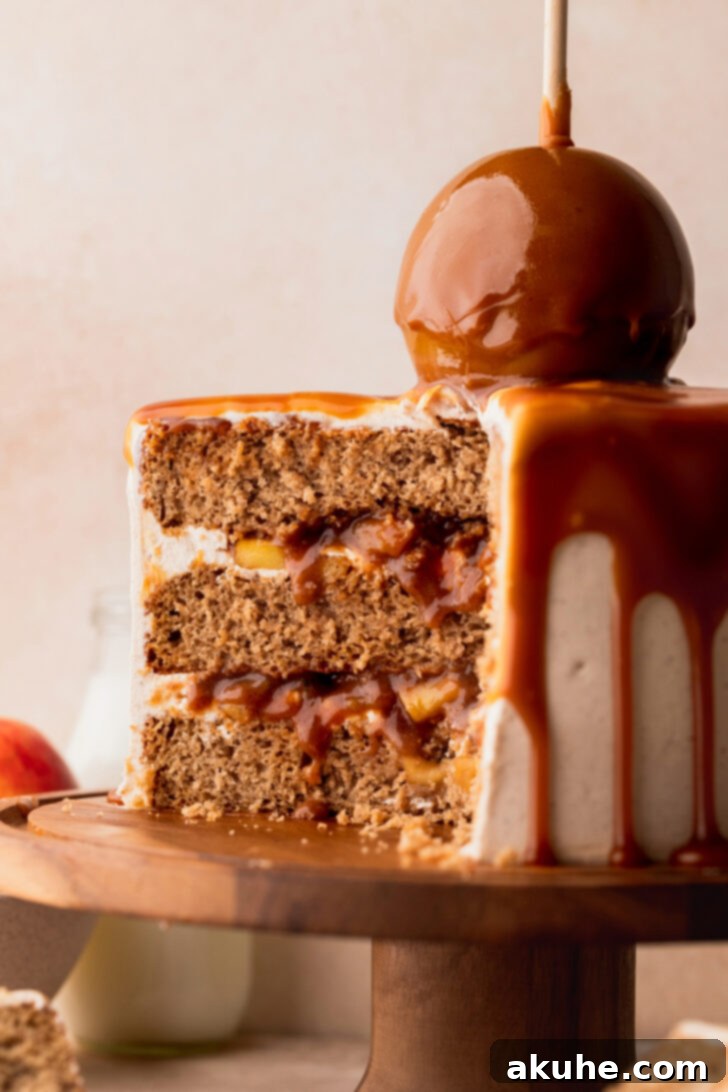 Decadent Caramel Apple Delight 11 A close-up view of the caramel apple cake, split to show the generous layers of filling and frosting.