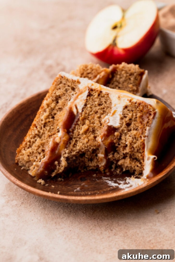 Decadent Caramel Apple Delight 12 A slice of caramel apple cake with a bite taken out, inviting you to taste.