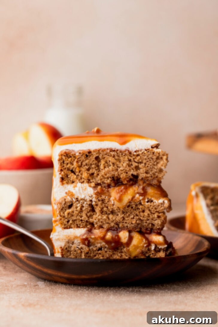 Decadent Caramel Apple Delight 3 A perfectly plated slice of caramel apple cake, showcasing its beautiful layers.