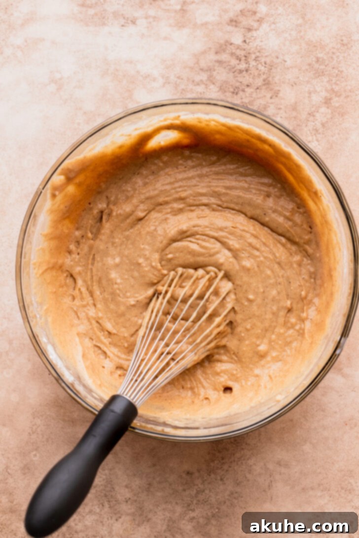 Decadent Caramel Apple Delight 5 Cake batter in a bowl, showing the consistency before baking.