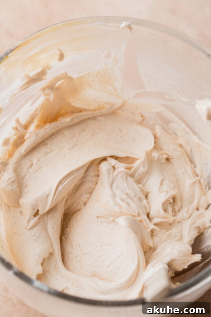 Decadent Caramel Apple Delight 7 Smooth, creamy caramel frosting in a mixing bowl.