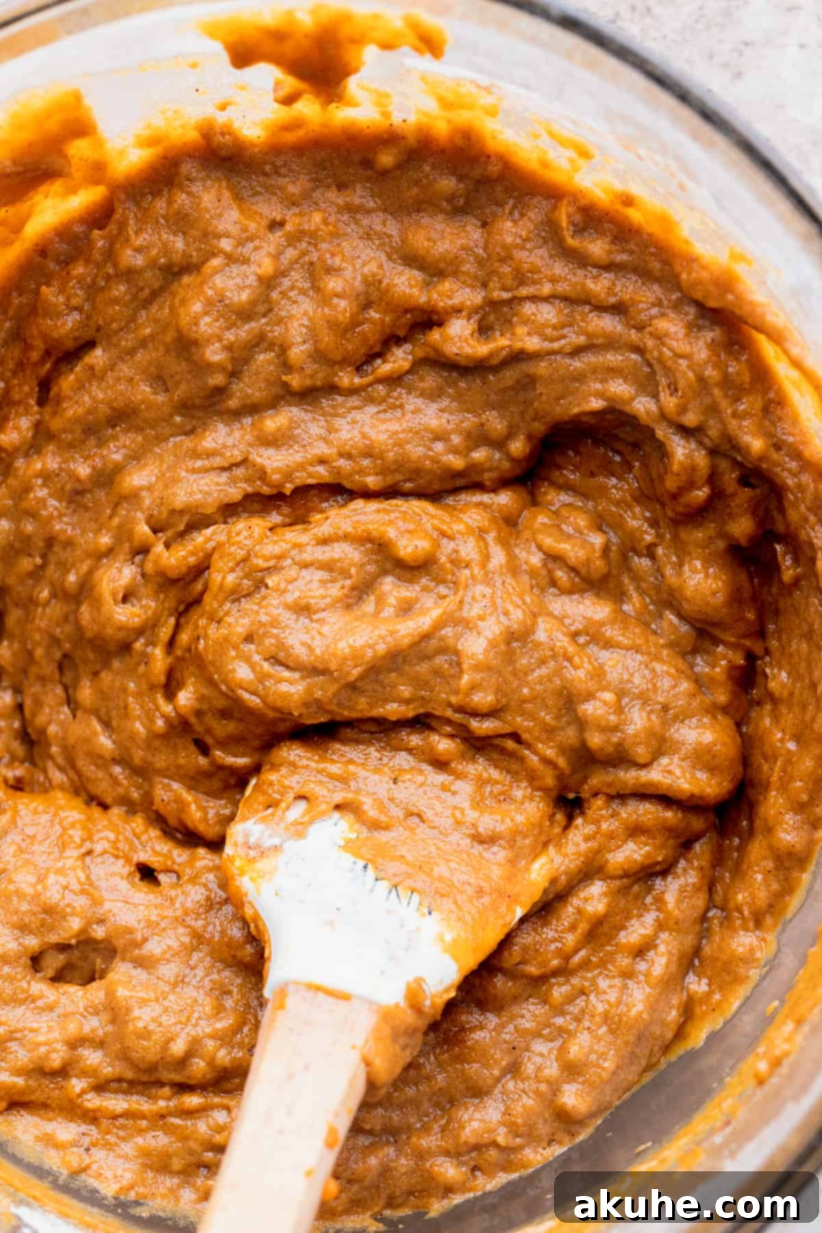 Spiced Pumpkin Loaf with Cream Cheese Frosting 6 Pumpkin bread batter in a glass bowl after combining wet and dry ingredients.