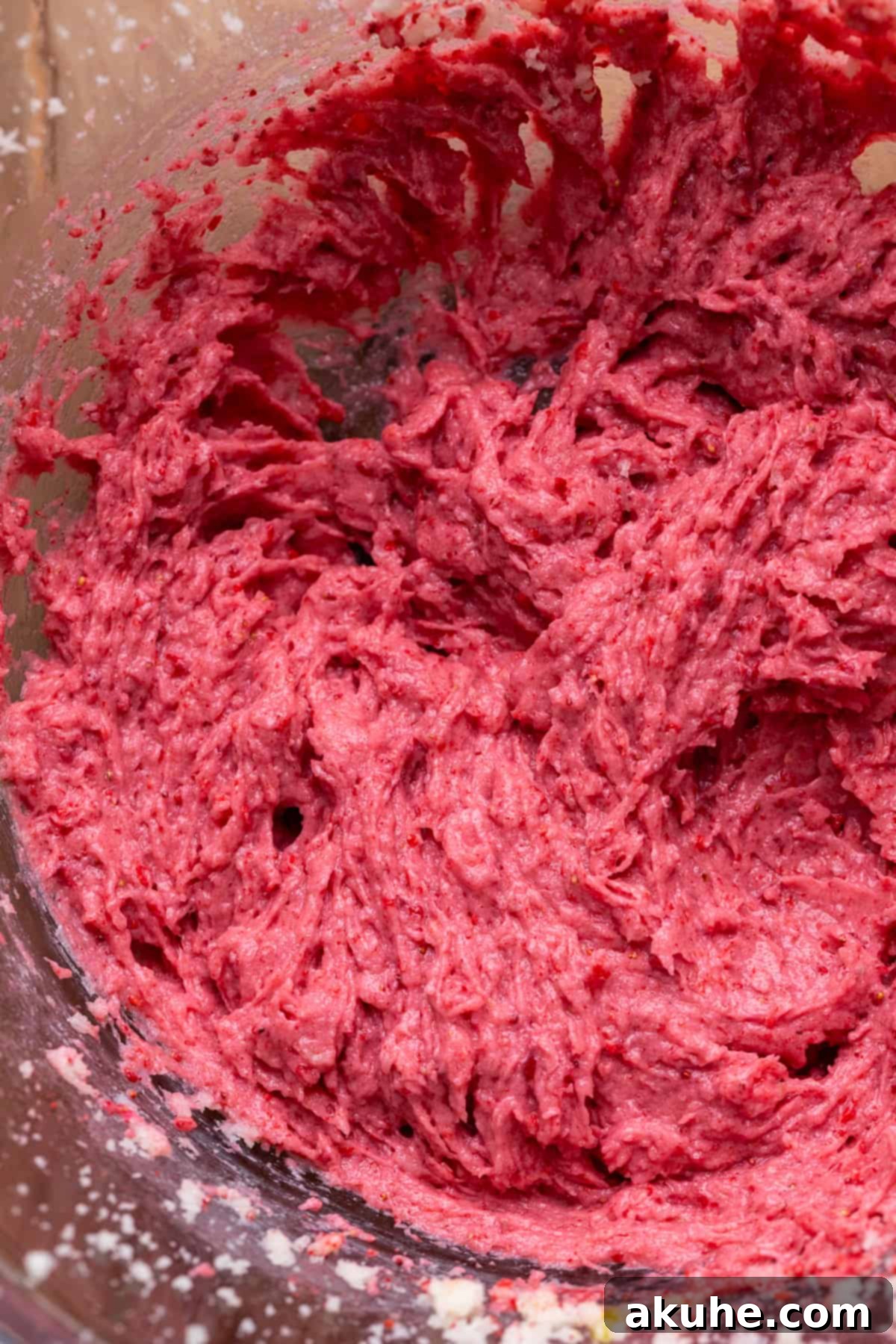 Pink Strawberry Crinkle Delights 4 Strawberry wet ingredients in a glass bowl, showing a vibrant pink mixture.