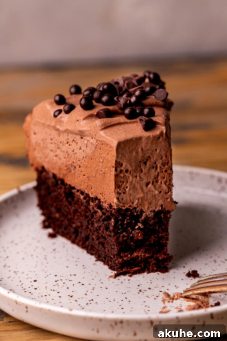 Decadent Chocolate Mousse Dream 13 A slice of chocolate mousse cake with a bite missing, tempting you to take another.