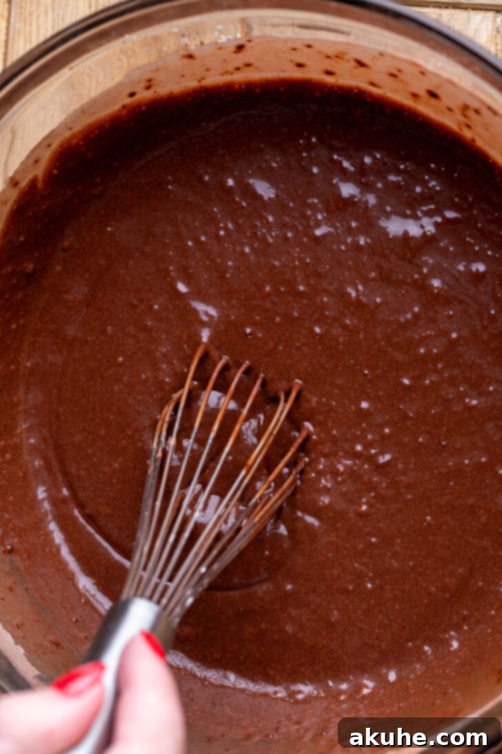 Decadent Chocolate Mousse Dream 4 Chocolate cake batter in a bowl, showing its smooth consistency.
