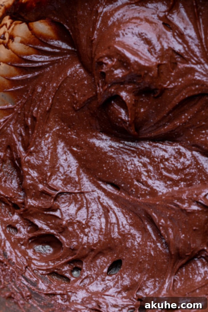 Decadent Chocolate Mousse Dream 6 Chocolate pudding being mixed in a bowl, the base for the mousse.