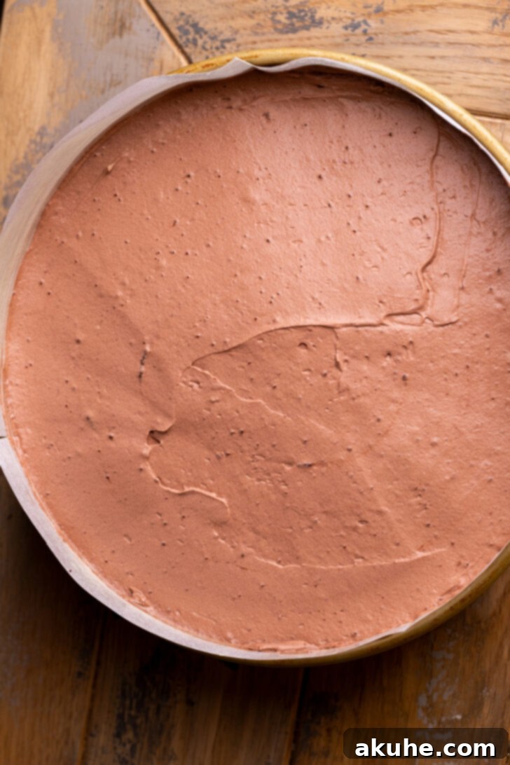 Decadent Chocolate Mousse Dream 9 Chocolate mousse spread evenly on top of the chocolate cake layer.