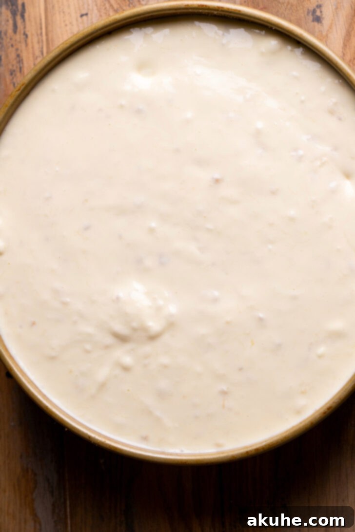 Southern Banana Pudding Cheesecake 7 The remaining cheesecake batter poured over the banana and Nilla Wafer layer.