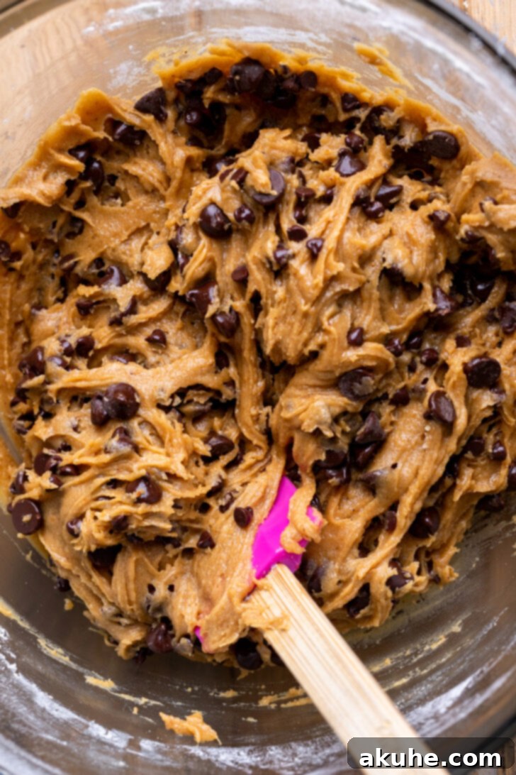 Nutty Brown Butter Chocolate Chip Cookie Slices 7 The finished cookie dough batter in a glass bowl, showcasing its smooth consistency and readiness for baking.