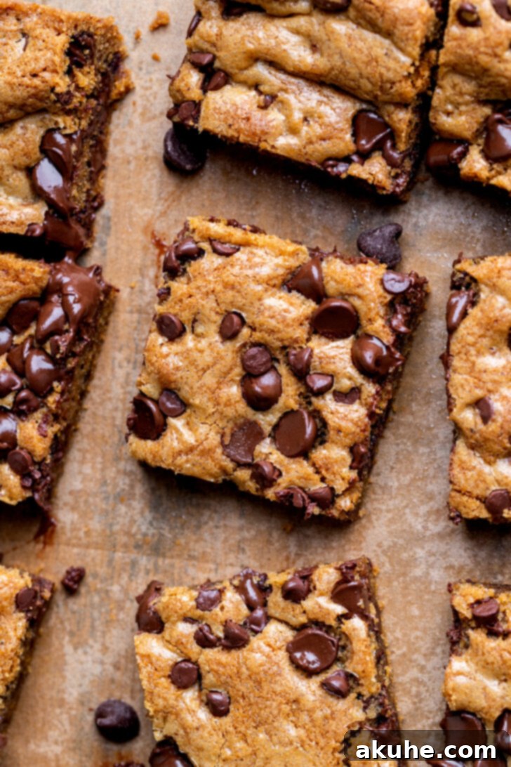 Nutty Brown Butter Chocolate Chip Cookie Slices 9 Close-up top view of the baked brown butter chocolate chip cookie bars, neatly cut into squares, showcasing their rich texture and embedded chocolate chips.