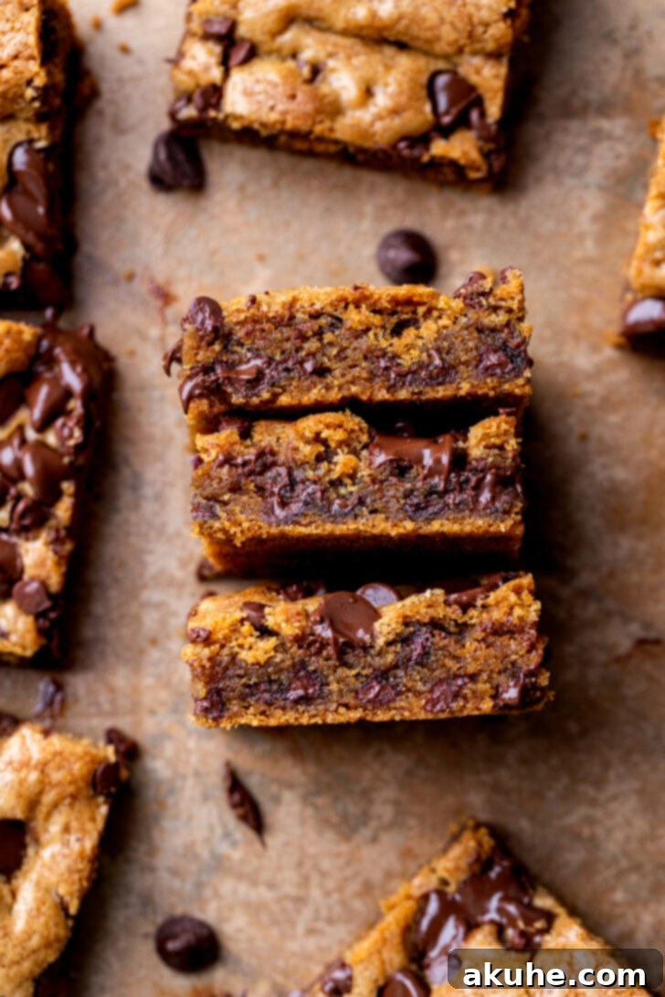 Nutty Brown Butter Chocolate Chip Cookie Slices 10 Side view of a perfectly baked brown butter chocolate chip cookie bar, highlighting its thickness and generous chocolate distribution.