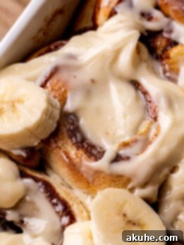 Banana Swirl Buns 11 Banana cinnamon rolls in a pan.