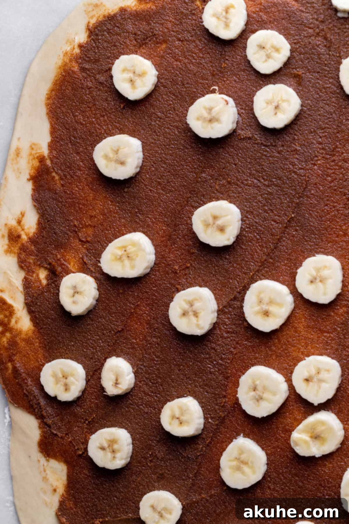 Banana Swirl Buns 5 Thinly sliced fresh bananas arranged in an even layer over the cinnamon filling on the dough.