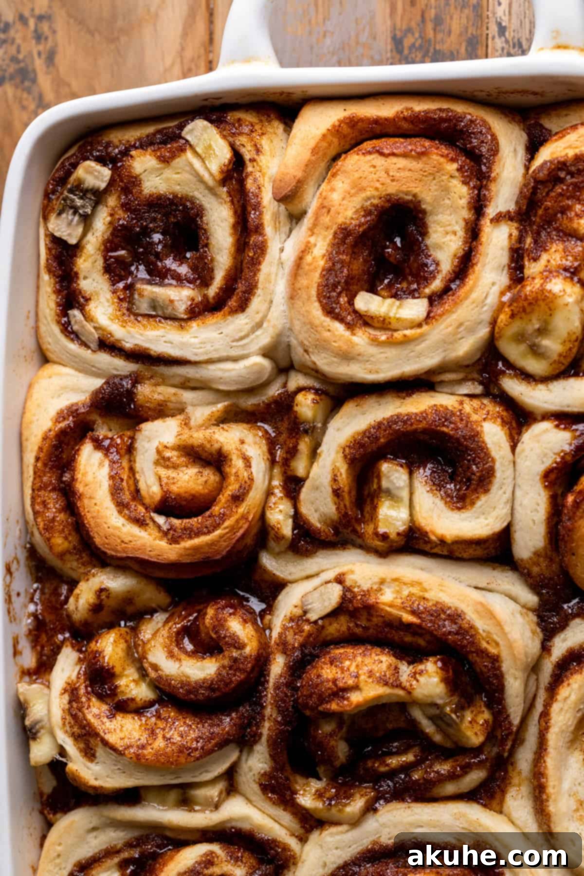 Banana Swirl Buns 7 Baked banana cinnamon rolls in a 9x13 inch pan, golden brown and still warm from the oven.