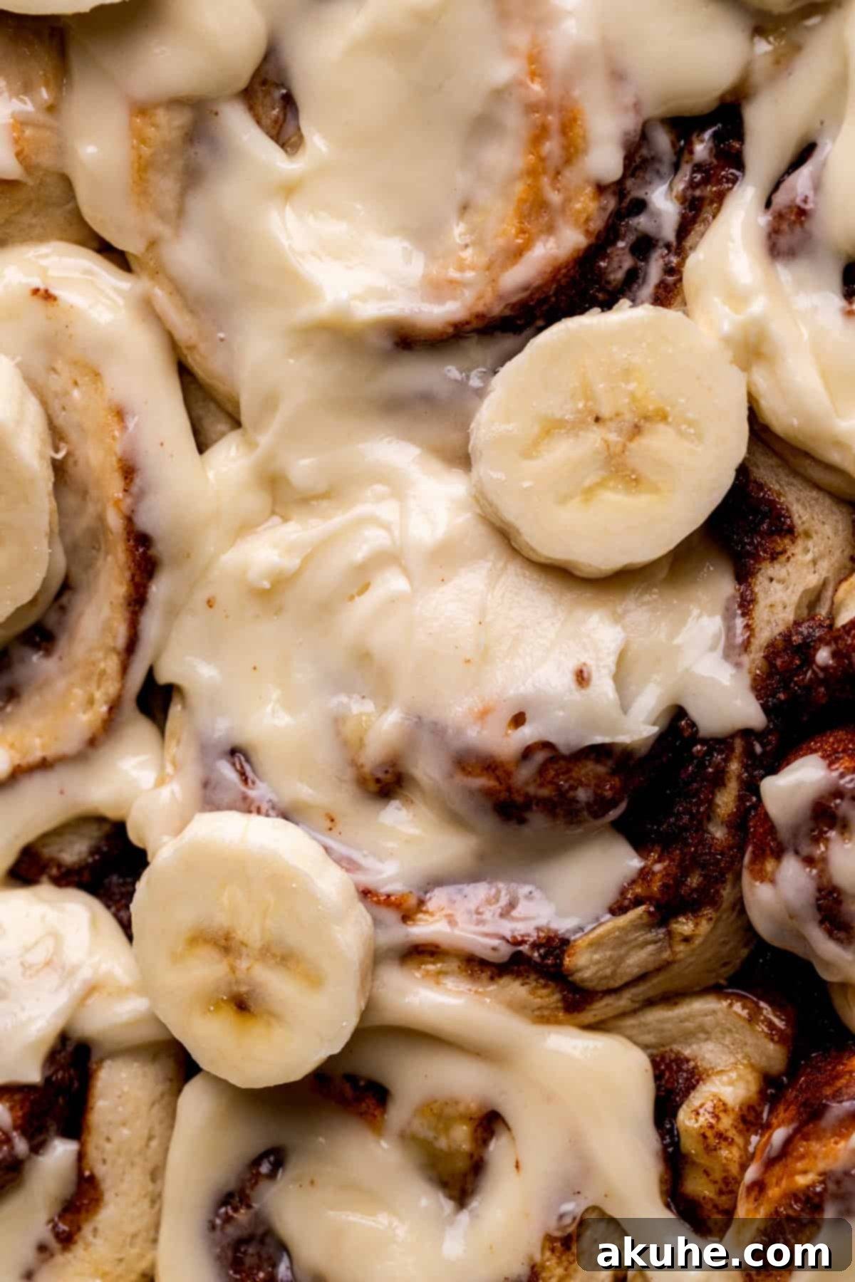 Banana Swirl Buns 10 Top-down view of a pan of Banana Cinnamon Rolls, perfectly baked and awaiting frosting.