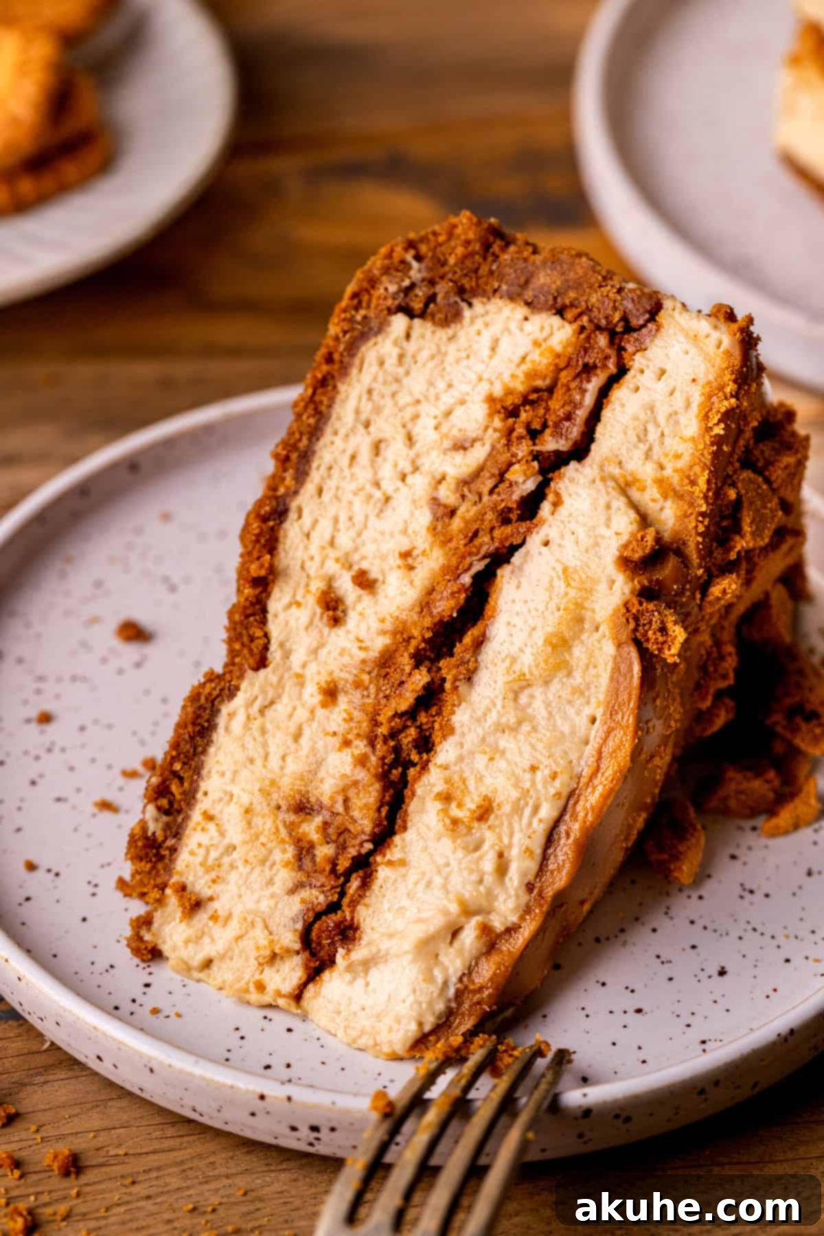 Decadent No-Bake Biscoff Cheesecake 2 Slice of no bake biscoff cheesecake on a plate.