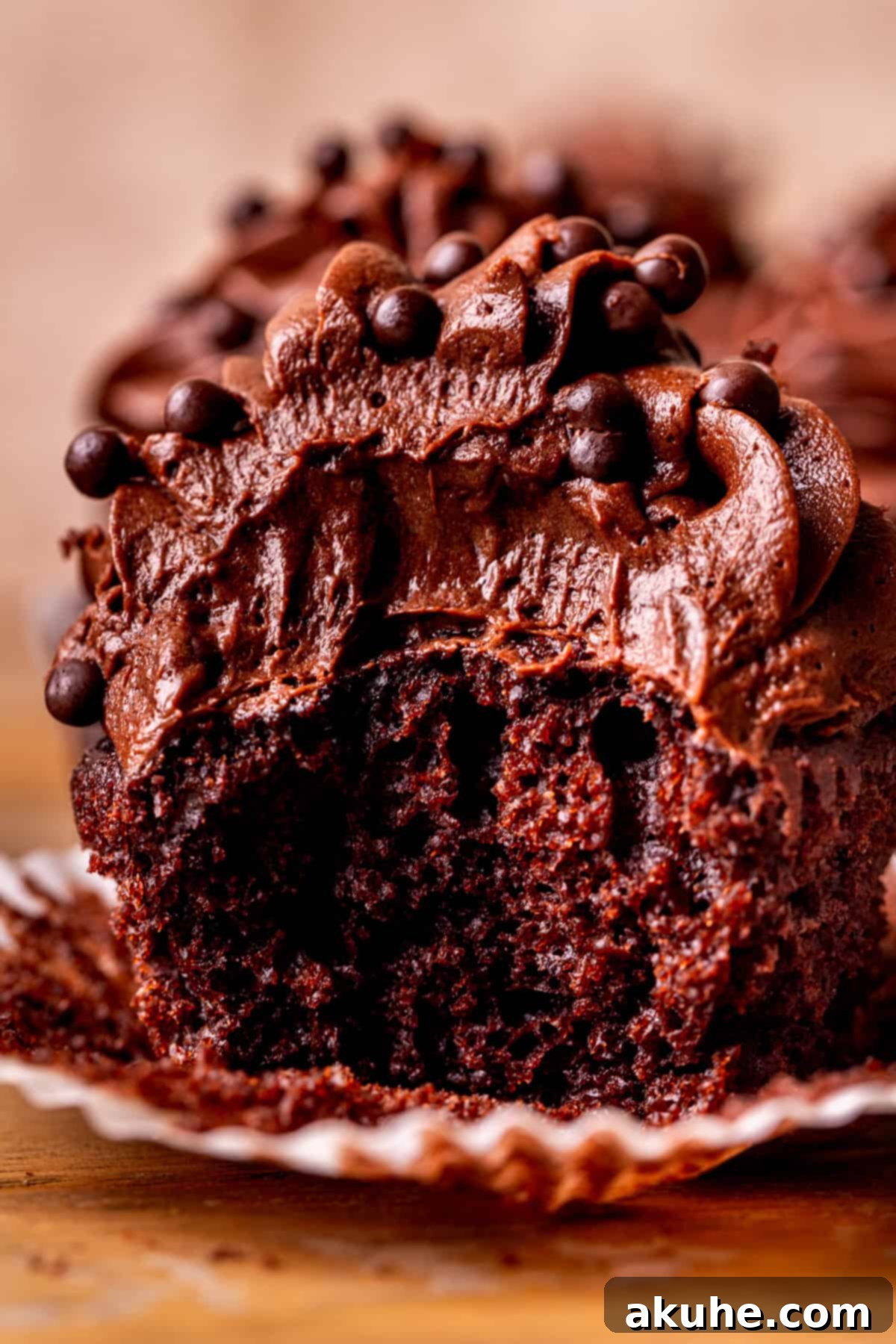 Decadent Chocolate Delights 11 Close up view of a rich, moist chocolate cupcake with decadent frosting.