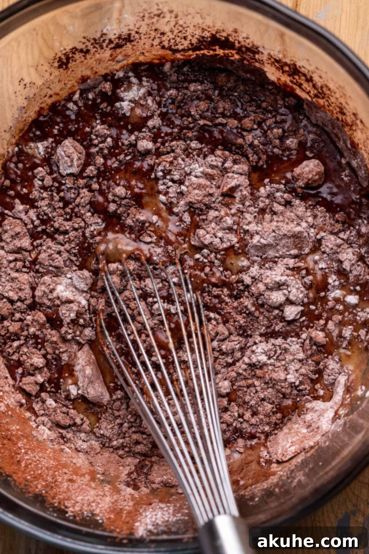 Decadent Chocolate Delights 4 Wet ingredients added to dry mixture in a bowl.