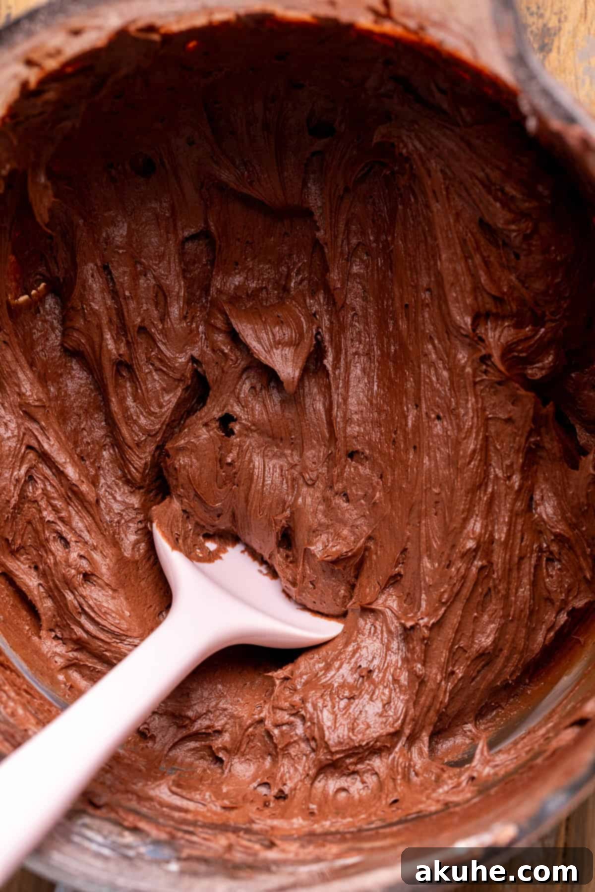 Decadent Chocolate Delights 8 Silky smooth chocolate cream cheese frosting in a glass bowl.