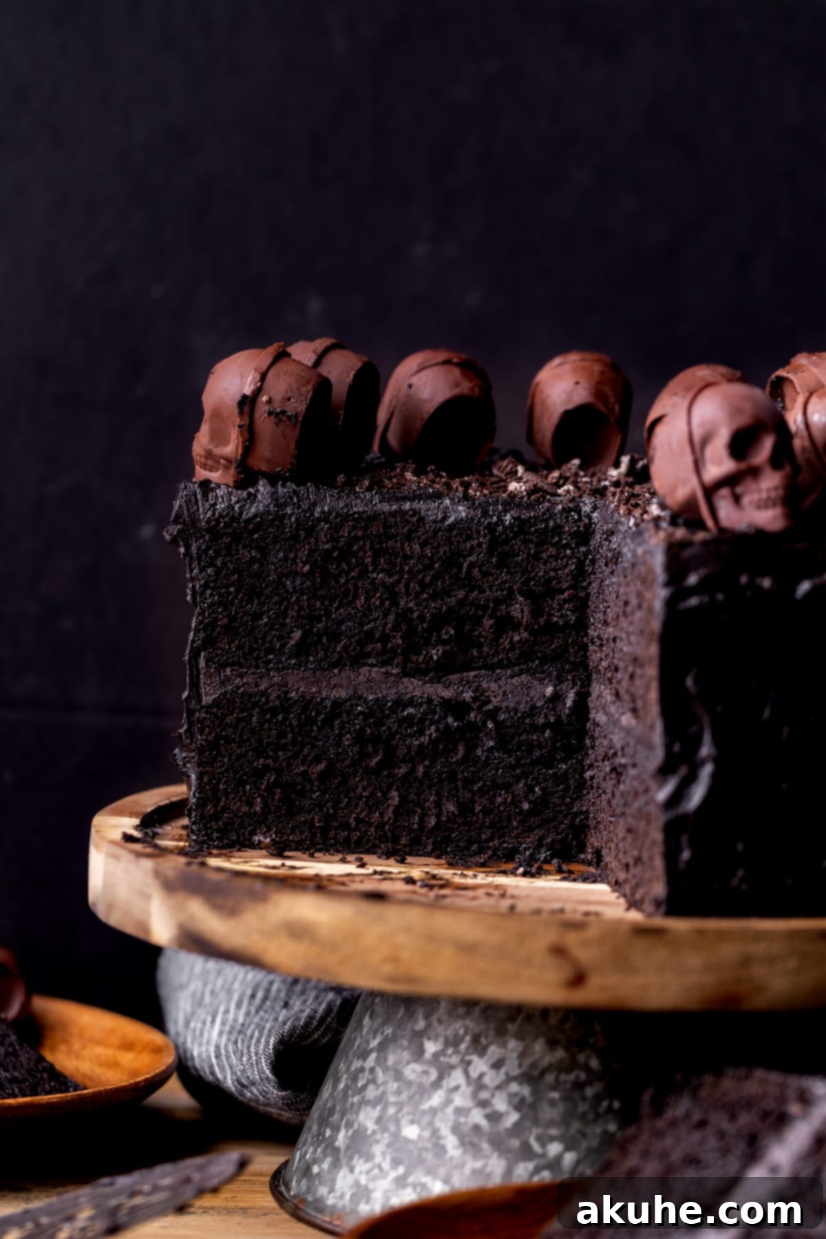 Bewitching Halloween Chocolate Cake 10 A slice removed from the Halloween chocolate cake, revealing its perfectly dark black velvet layers and rich frosting.