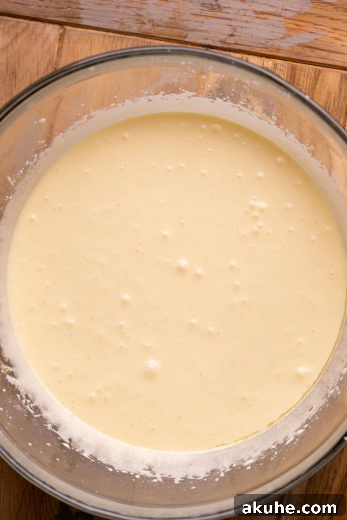 Decadent Fudgy M and M Brownies 4 Wet ingredients beautifully combined in a mixing bowl, showing the smooth, rich batter base.