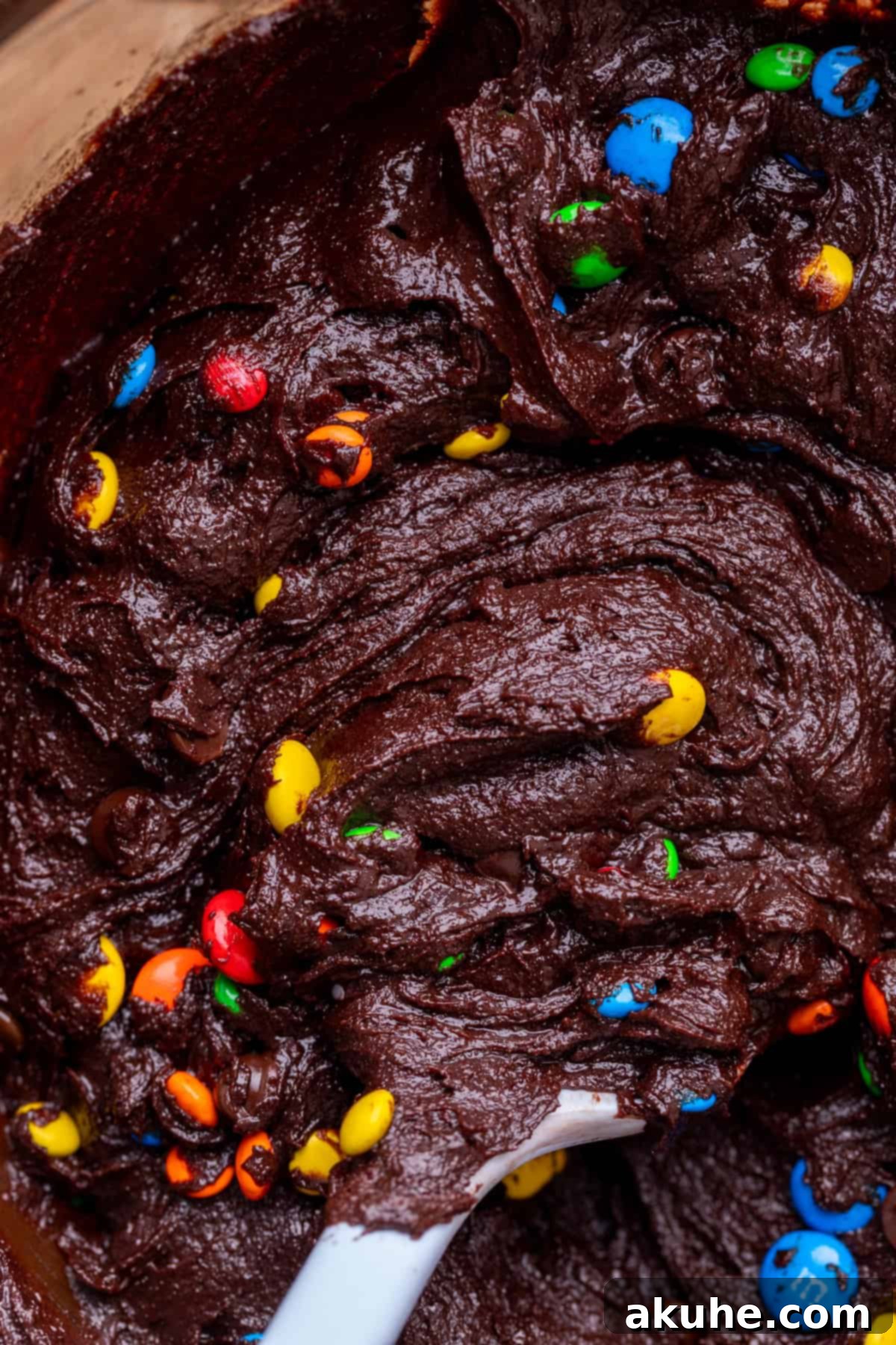 Decadent Fudgy M and M Brownies 6 Smooth, rich brownie batter waiting to be poured into the baking pan, showing its enticing texture.