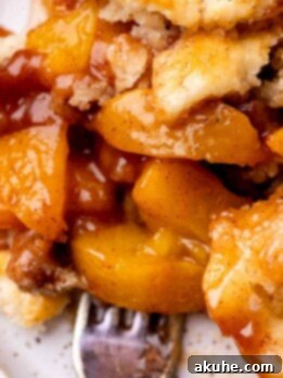 Cinnamon peach cobbler on a plate.