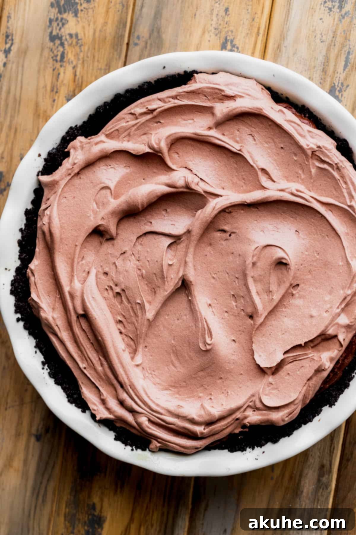 Smooth chocolate whipped cream spread beautifully on top of the pie.