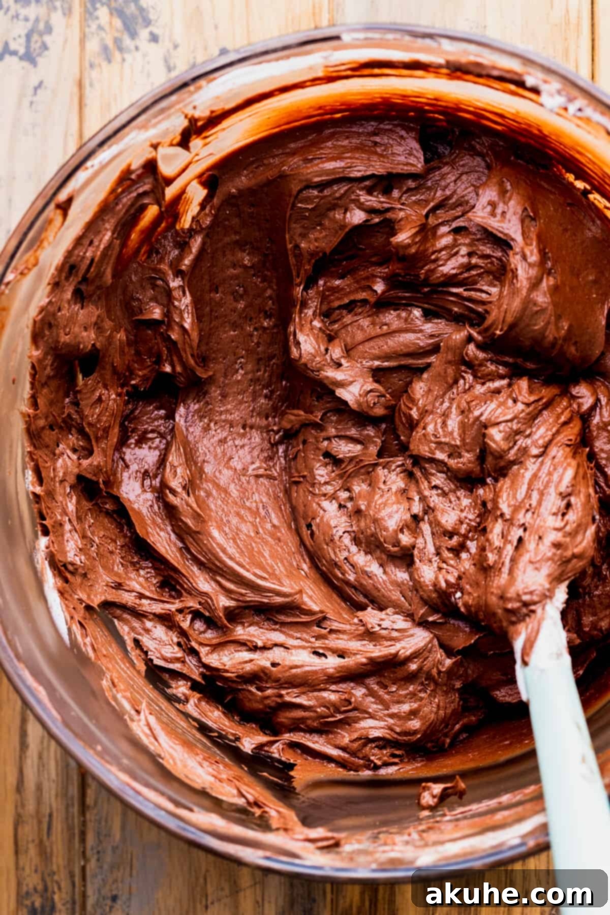 Chocolate pie batter in a glass bowl, showcasing its rich color and consistency.