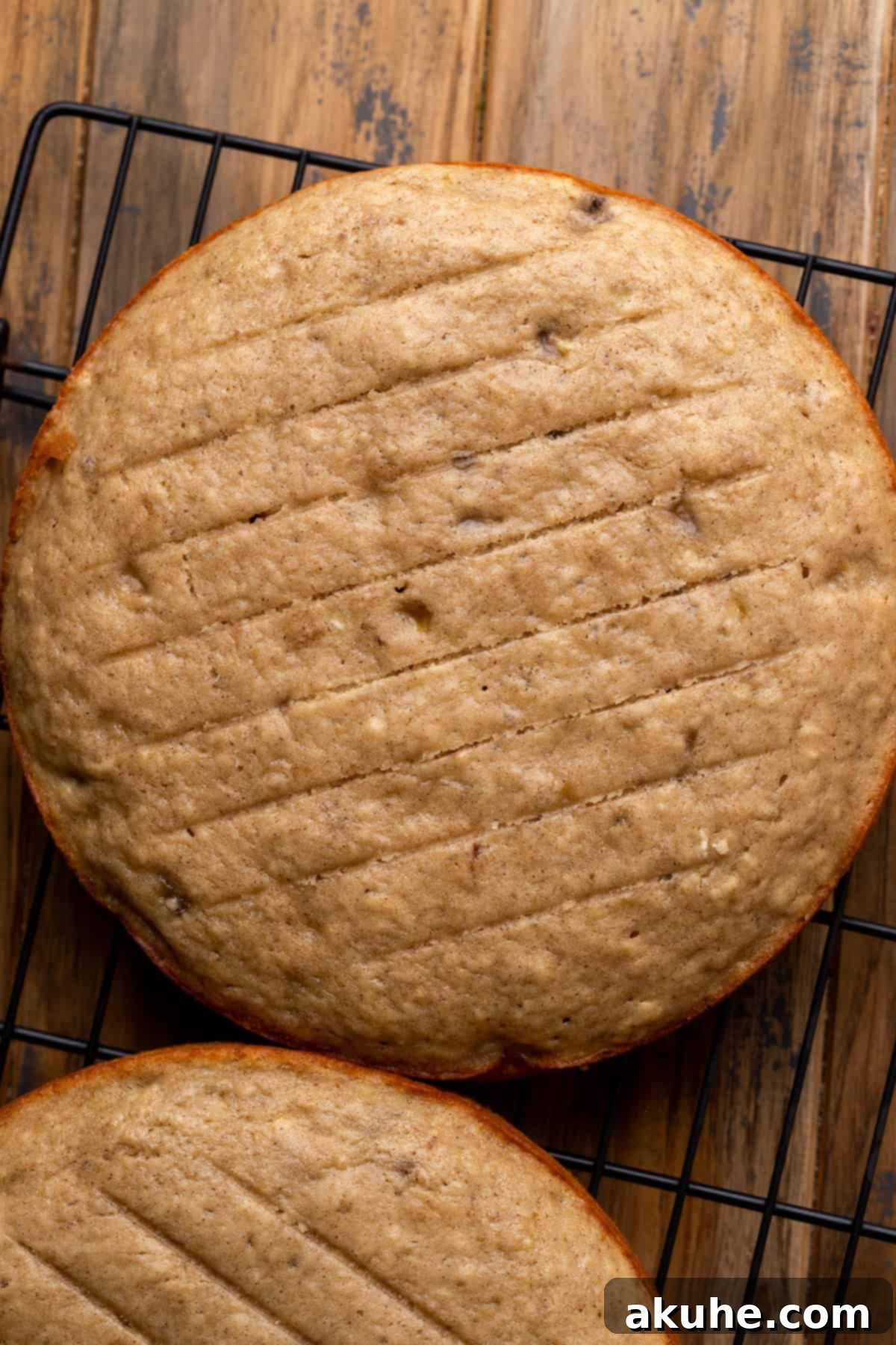 Decadent Banana Chocolate Dream Cake 6 A freshly baked banana cake layer cooling on a wire rack.