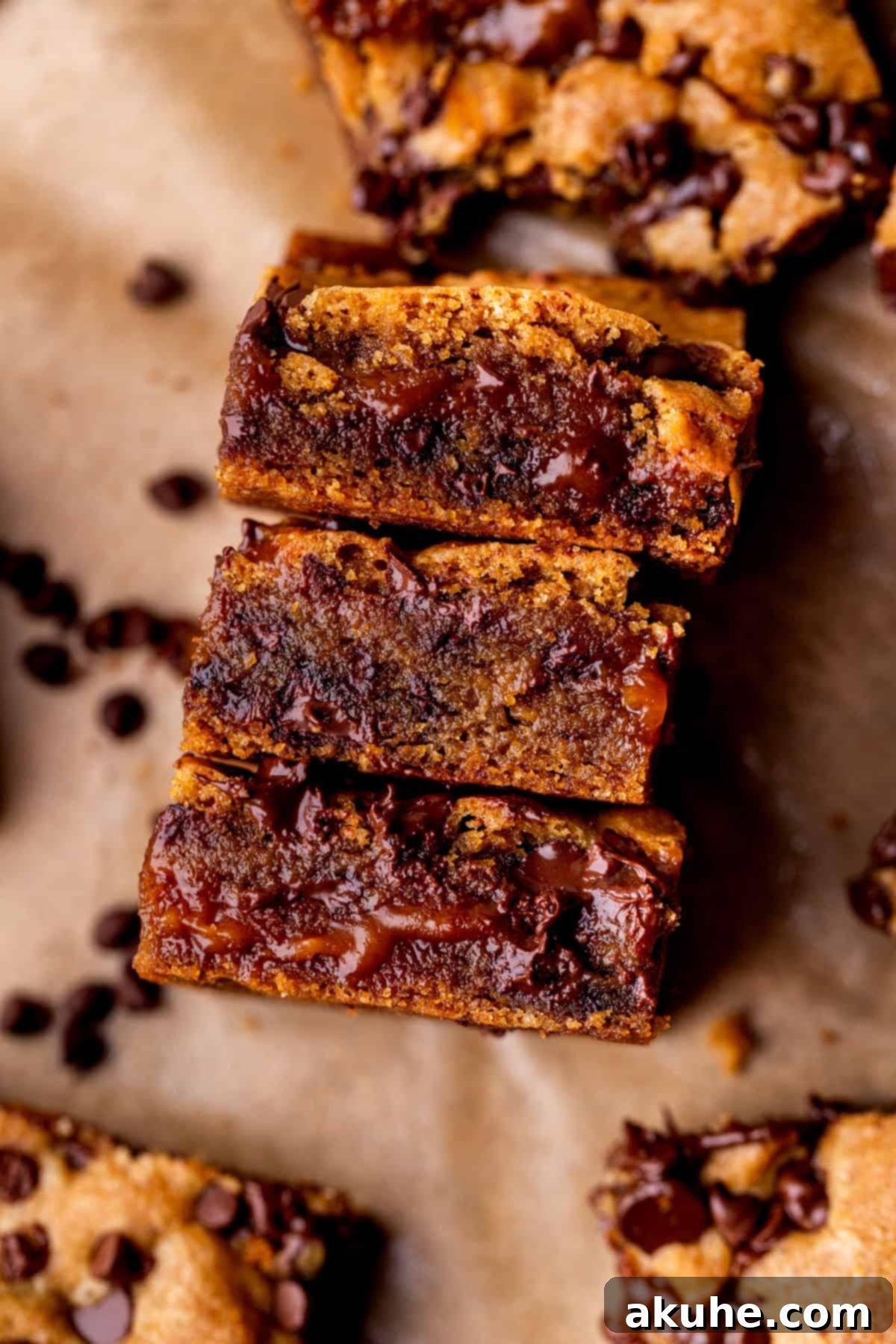 Decadent Caramel Cookie Bars 11 Three caramel cookie bars stacked neatly on their side, showcasing their thickness and delightful layers.