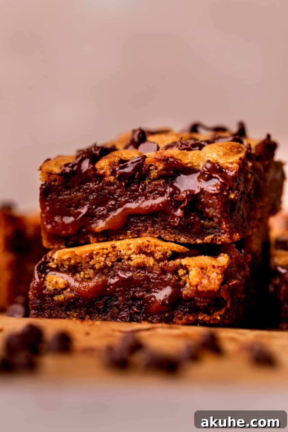 Decadent Caramel Cookie Bars 12 Close-up of a stack of caramel cookie bars, highlighting the rich chocolate chips and gooey caramel.