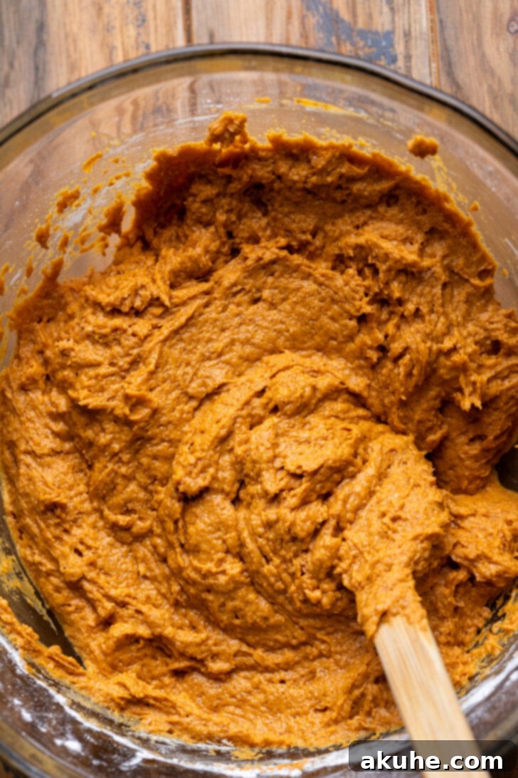Autumn Pumpkin Streusel Cake 4 Pumpkin cake batter in a bowl, showing its thick consistency.