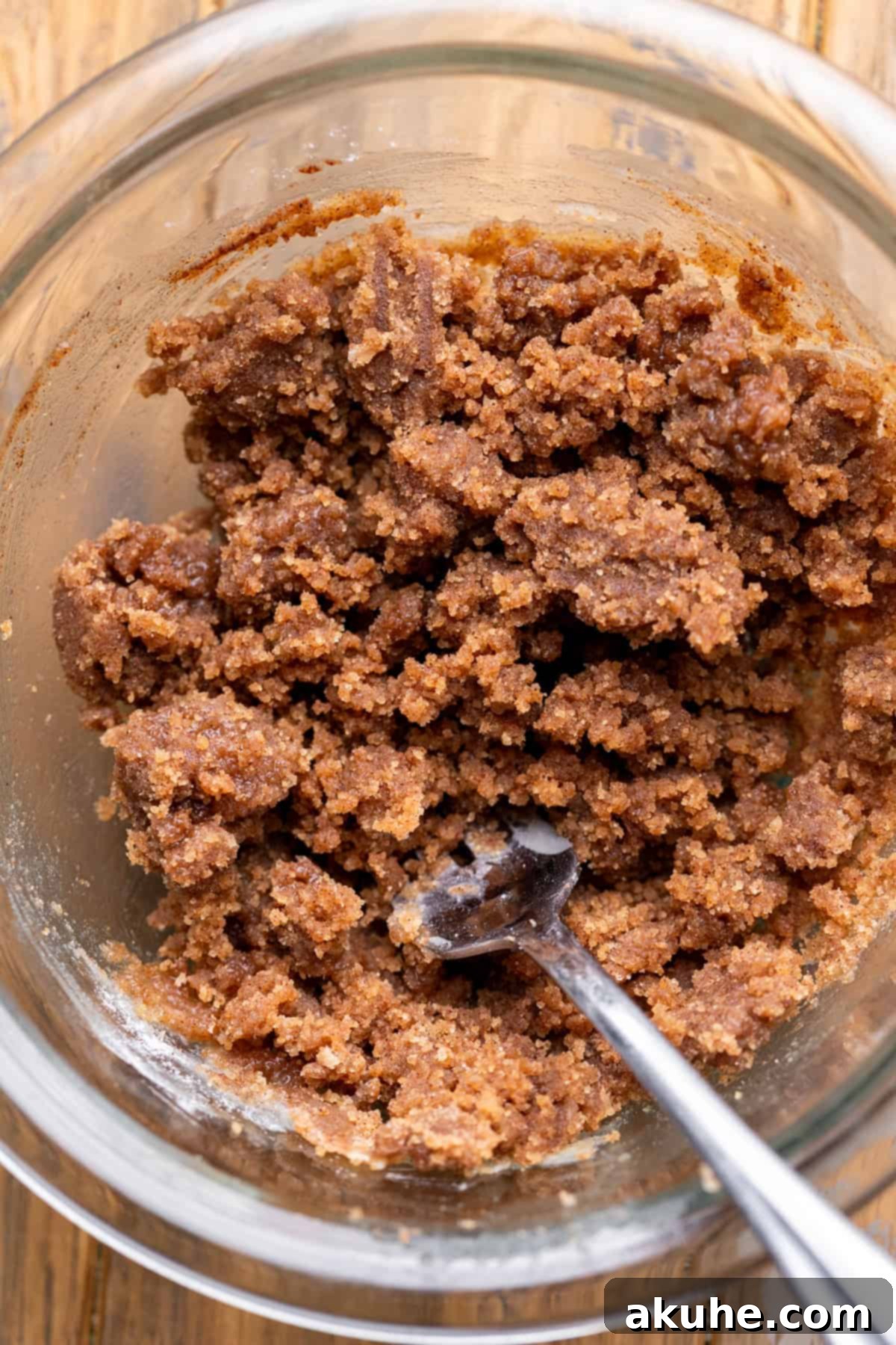 Rich, dark cinnamon filling mixture in a glass bowl, showcasing its readiness to be swirled into cupcakes.