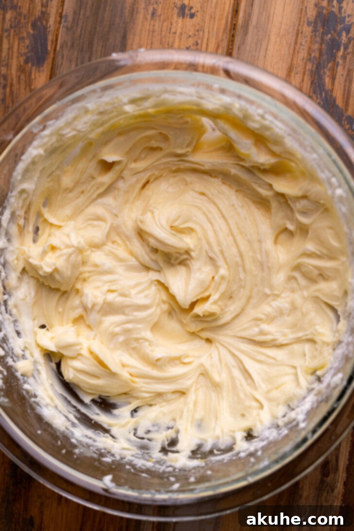Cream Cheese Swirled Pumpkin Bread 4 Smooth cream cheese filling in a mixing bowl, perfectly at room temperature.