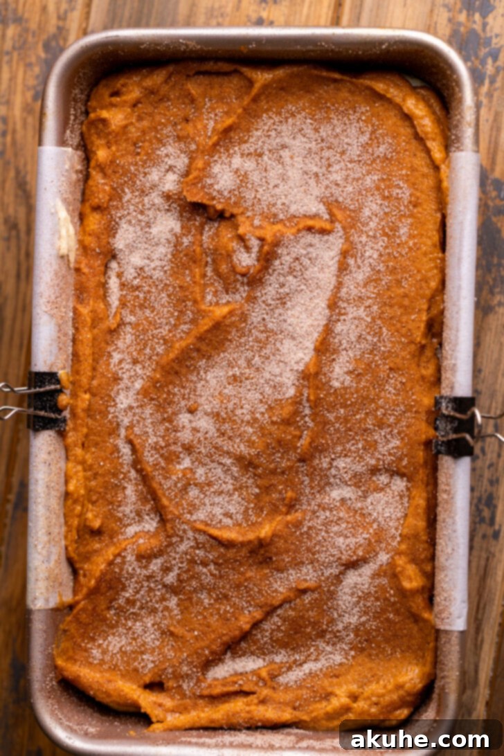 Cream Cheese Swirled Pumpkin Bread 7 Generous sprinkle of cinnamon sugar on top of the pumpkin and cream cheese batter in the pan.